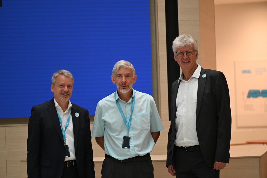 Chair Martin Muller stands next to former chairs Robert McGreevy and Helmut Schober